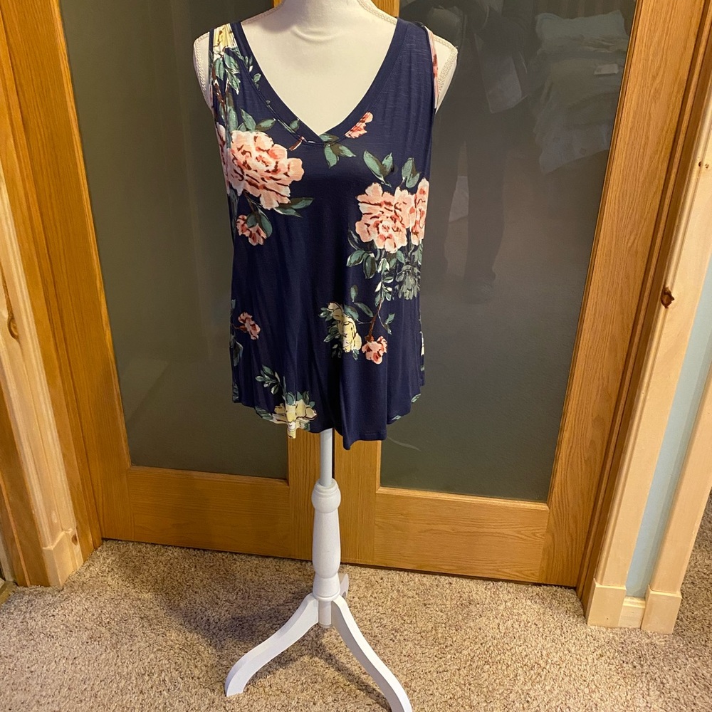 Tank top has blue over lay on top of print